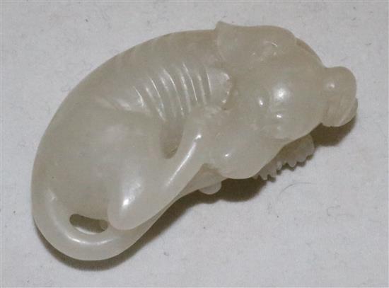 A Chinese white jade figure of a recumbent hound, 20th century, 5cm